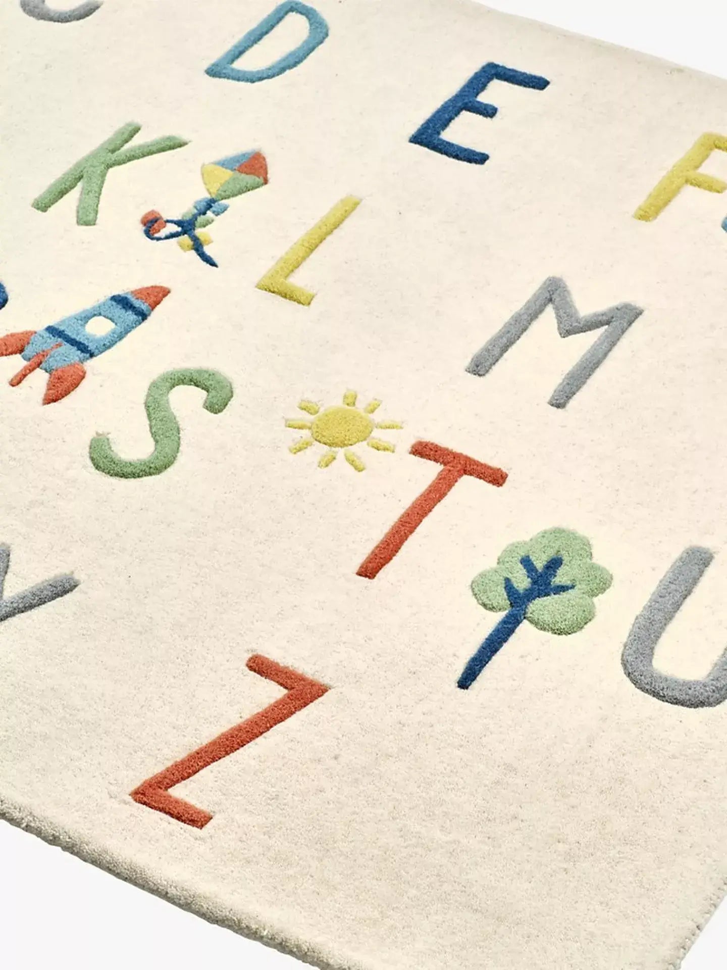 hand tufted wool rug for kids with colorful letters and symbols