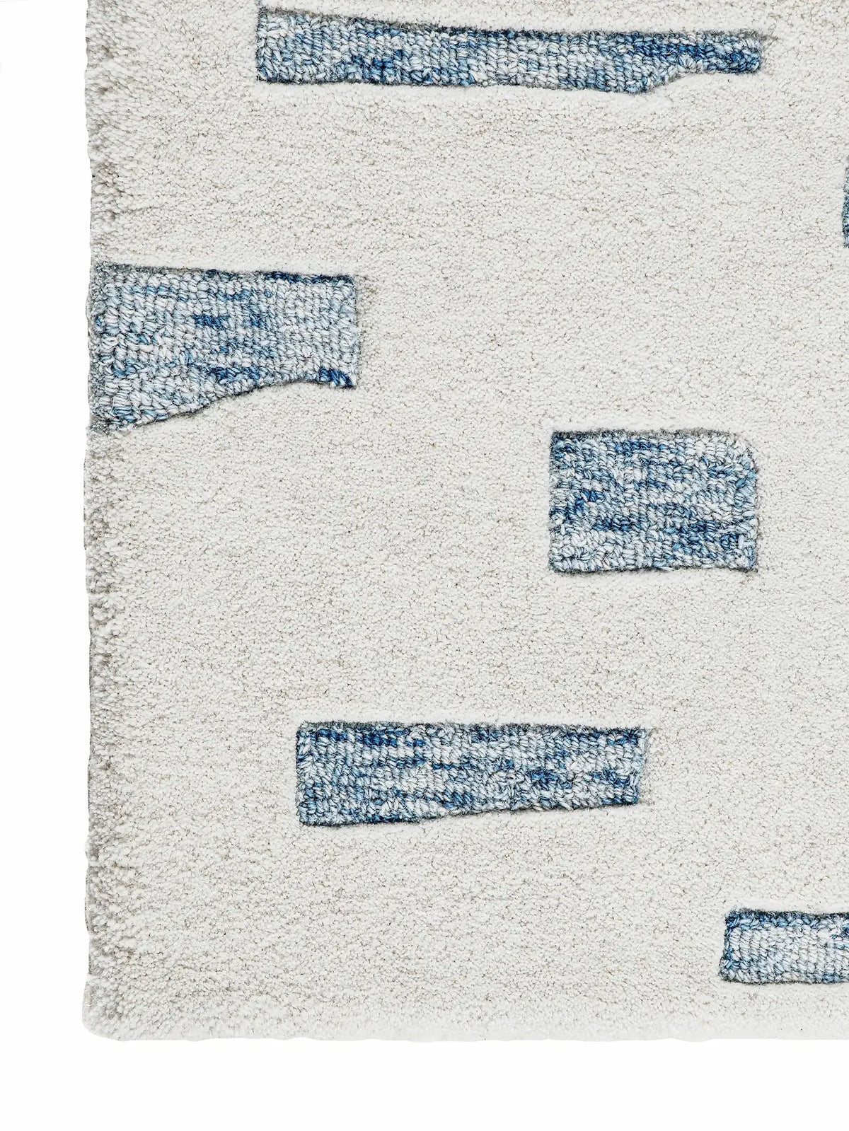 close up of hand tufted wool rug corner