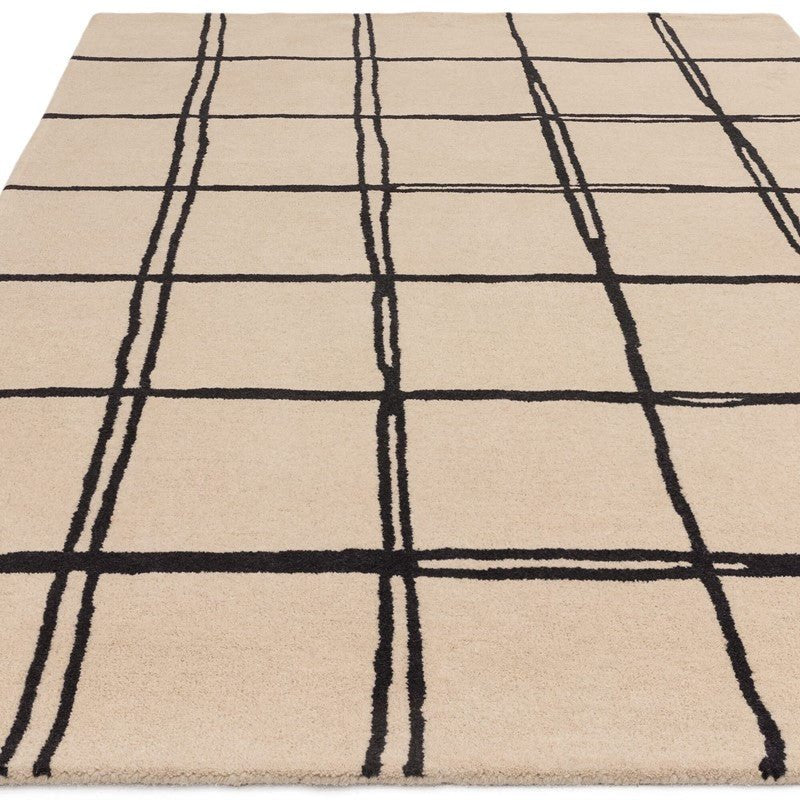 tufted beige rug with black grid pattern