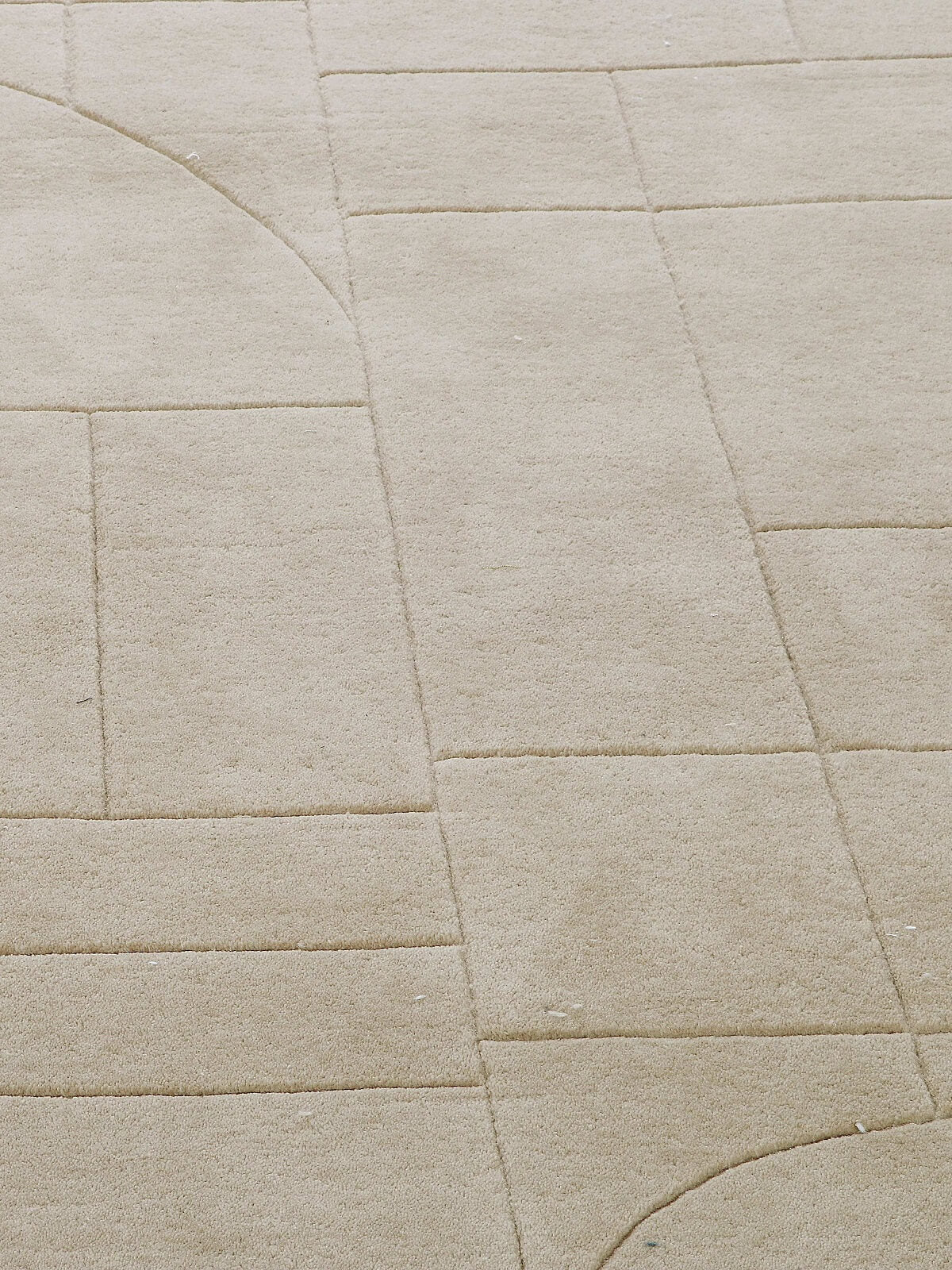 close up of beige wool rug