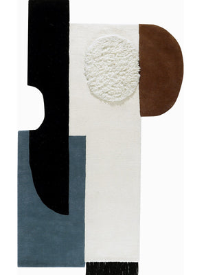 modern tufted wool rug with geometric shapes in black, white, brown, and blue