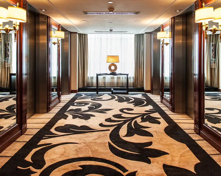 large handmade rug in hotel hallway