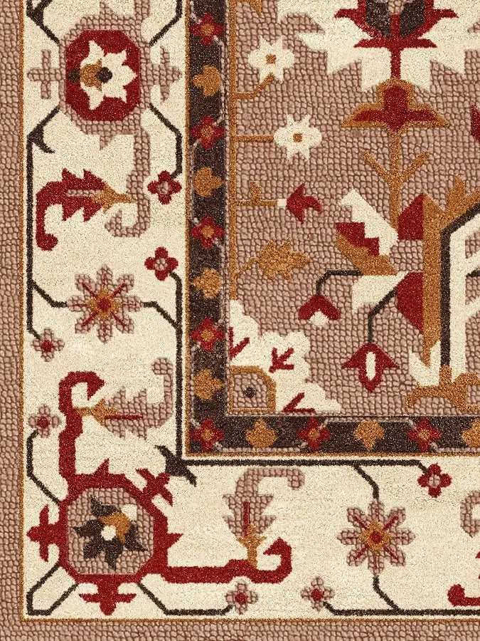 Close-up of a patterned wool rug with floral and geometric designs