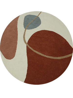 hand tufted round wool rug with abstract design