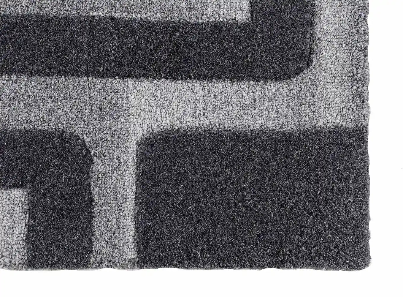 grey black wool rug corner close up