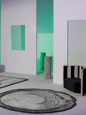 round shaped modern wool rug in grey and black