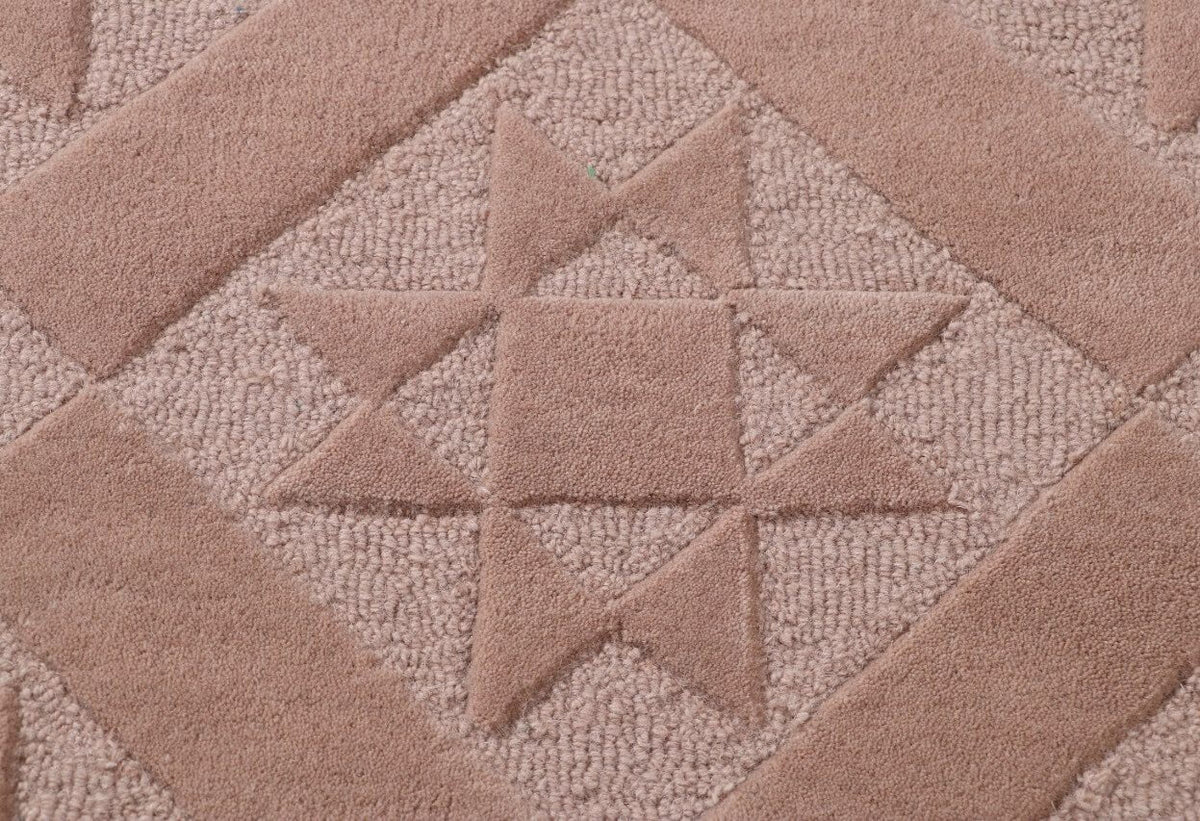 close up of texture hand tufted rug with geomatric pattern