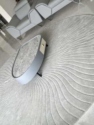 tufted round wool rug in grey