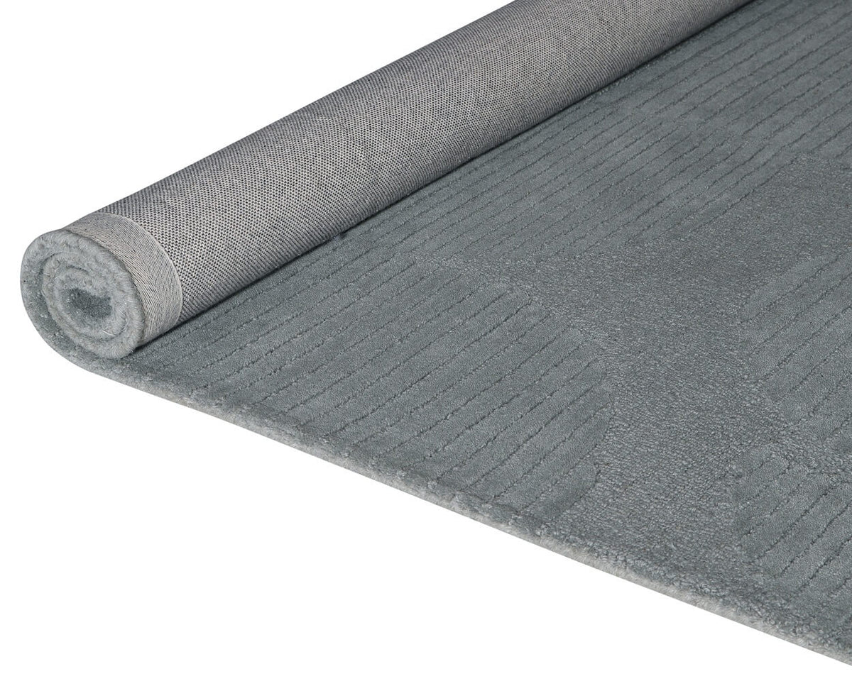 grey hand tufted wool rug roll