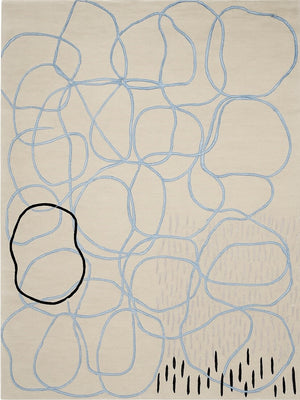 hand tufted abstract design wool rug with blue lines and black shapes