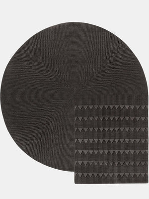 black hand tufted round rug with geometry pattern