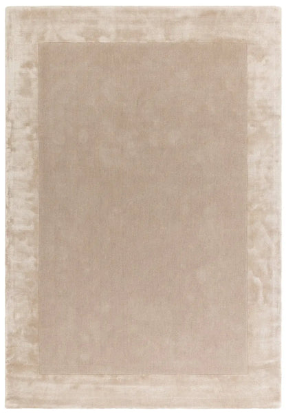 Beige tufted area rug with a subtle border