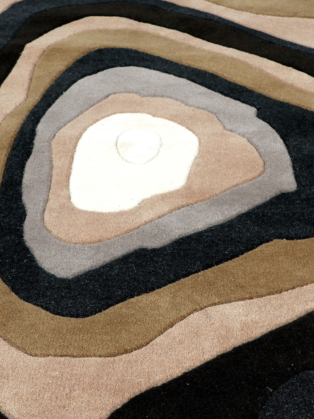 Close-up of a hand tufted textured wool rug
