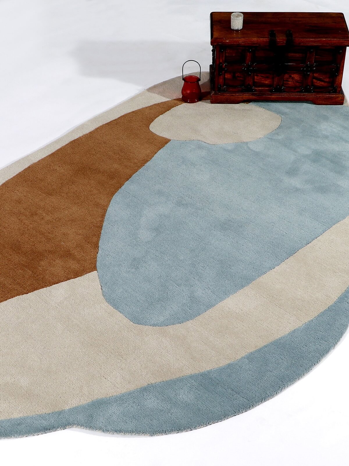 Multicolored hand tufted wool rug with brown, blue, and beige