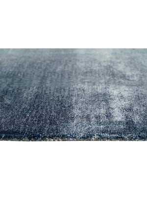 Close-up of a textured tufted blue rug