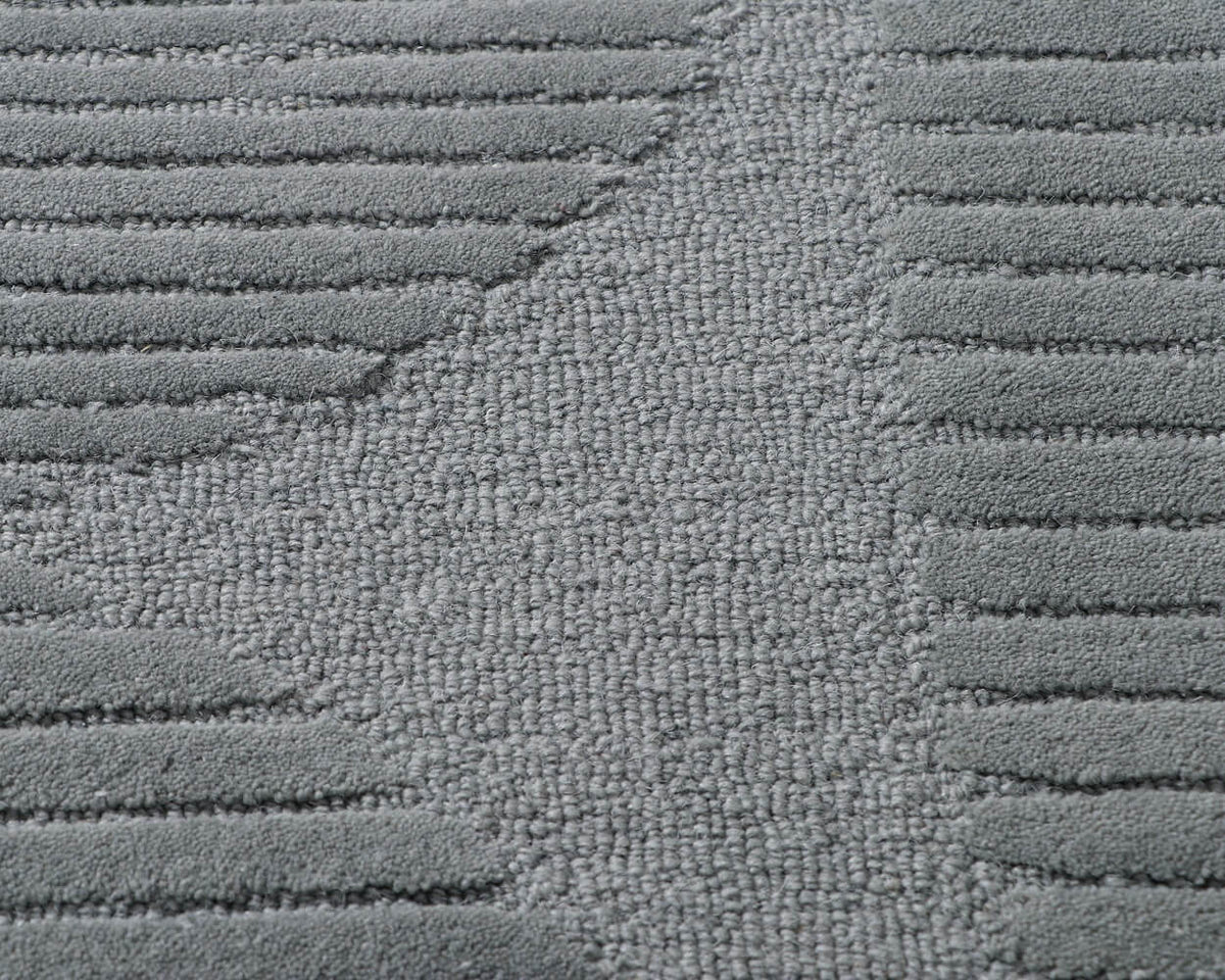 closeup of silhouette tufted shaped wool rug