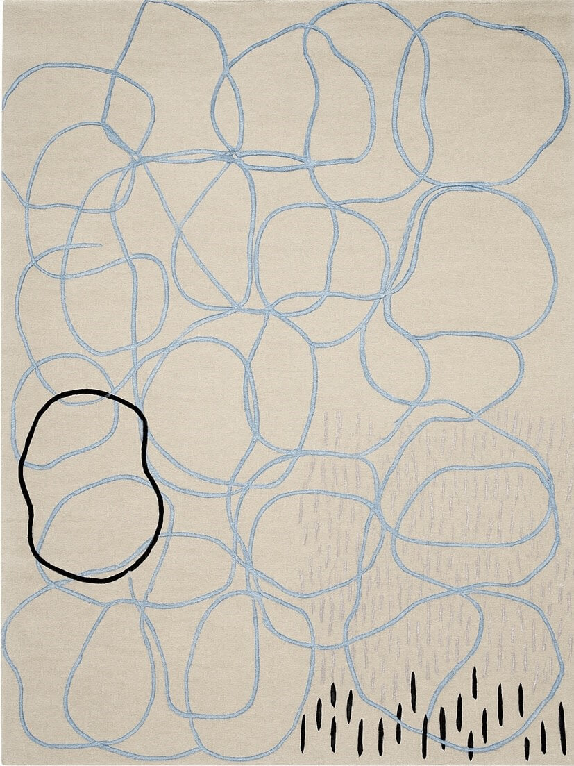 hand tufted abstract design wool rug with blue lines and black shapes