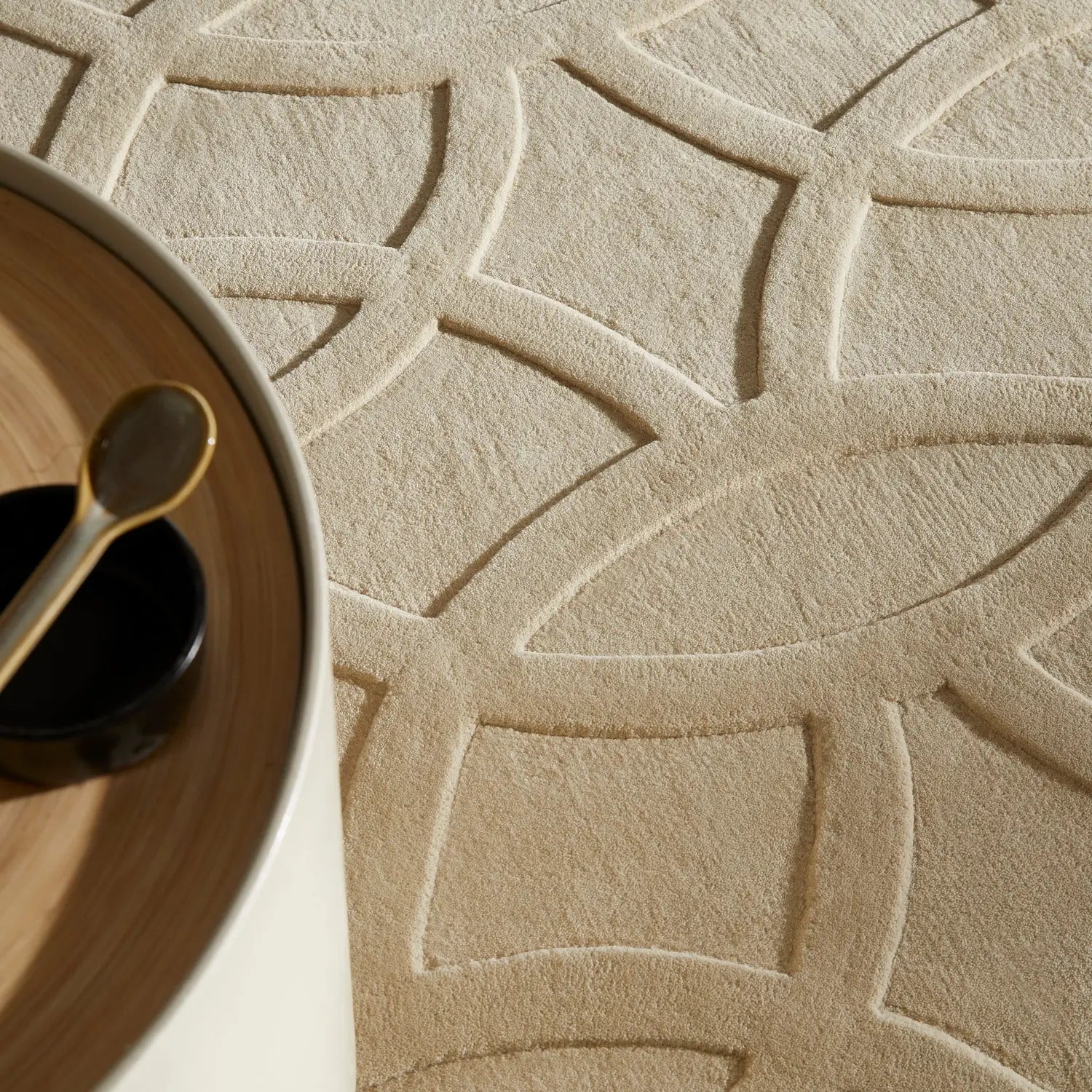 Close-up of a textured beige wool rug