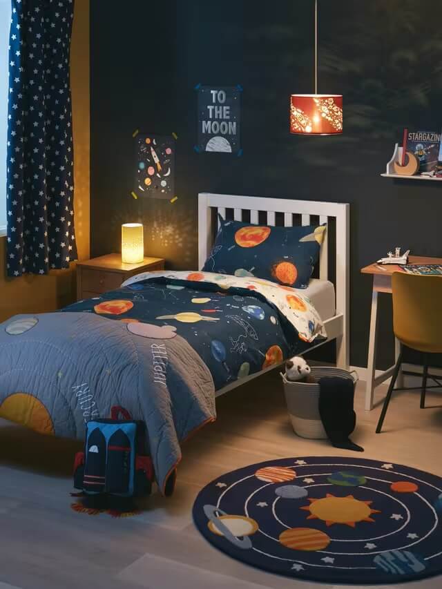 Children's bedroom with space-themed bedding and decor