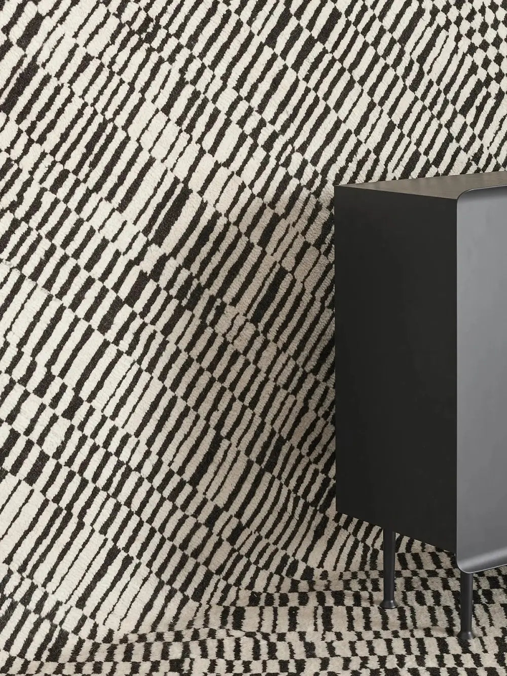 Black and white geometric patterned wool rug