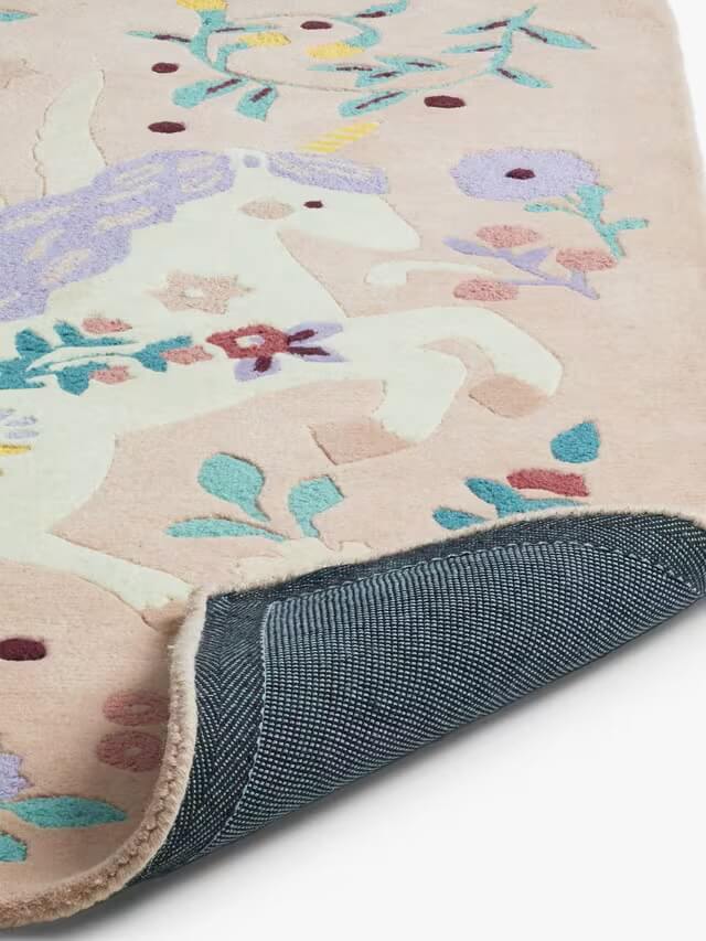 hand tufted wool rug for kids room with unicorn and floral pattern